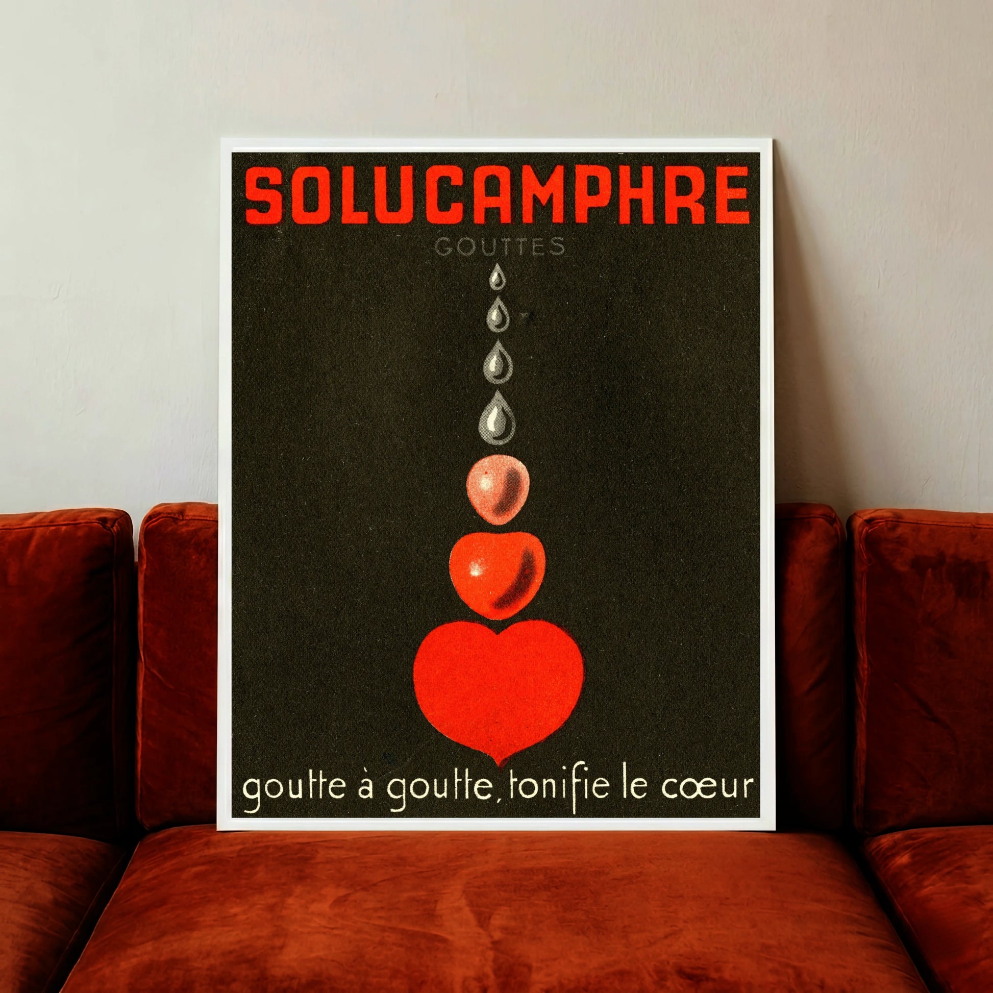 Vintage Poster Werbung für Solucamphre mit Tropfen die ein rotes Herz bilden.