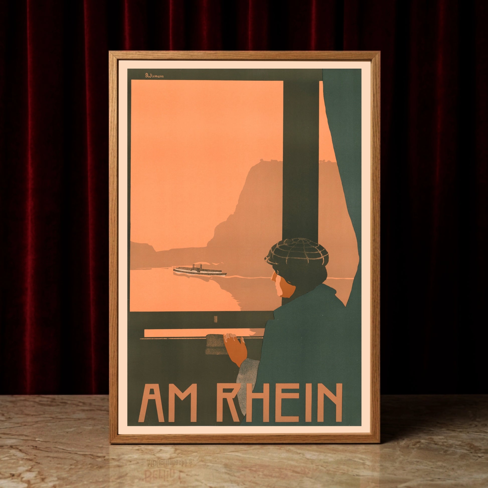 Detailansicht eines Vintage-Drucks mit der Aufschrift Am Rhein und grafischen Naturmotiven.