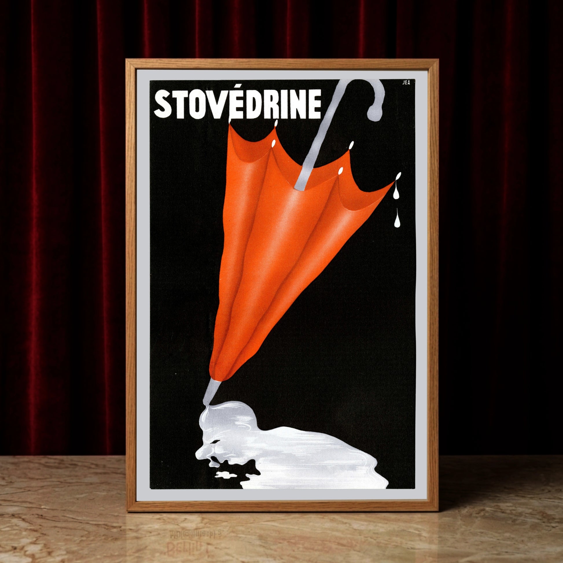 Vintage-Werbeplakat für Stovédrine mit einem geschlossenen roten Regenschirm auf schwarzem Hintergrund.